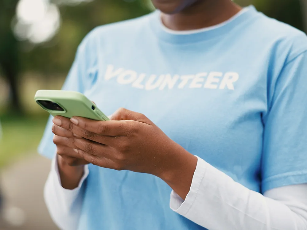 Volunteer on her phone